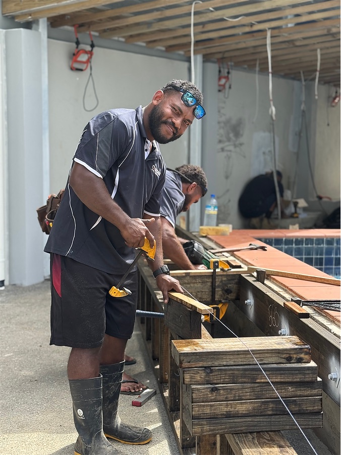 Crew building joinery on site