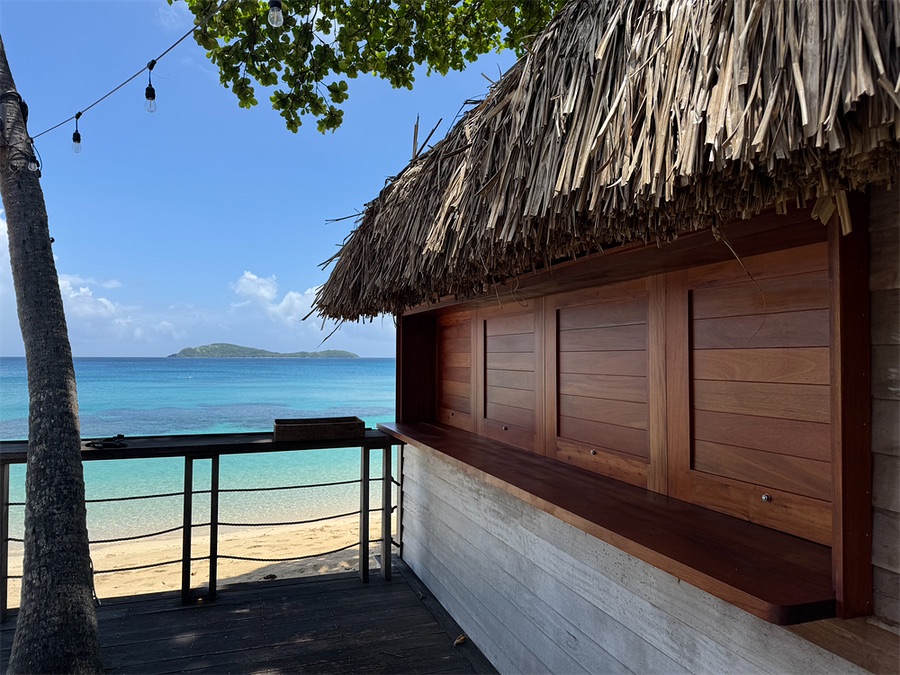 Thatched beach bar over the lagoon