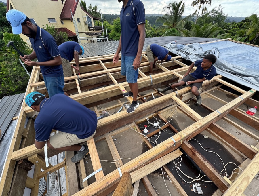 The crew fixing the new roof structure