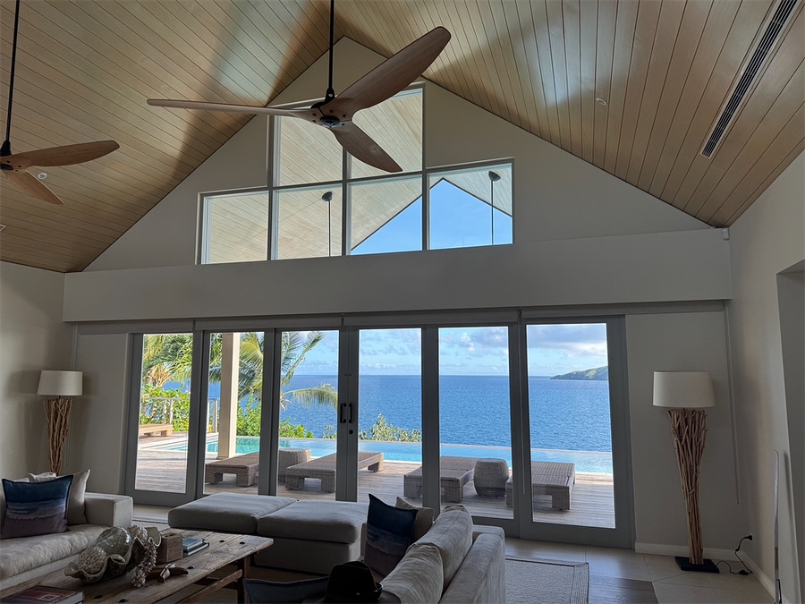 Ocean-view living room with tall windows