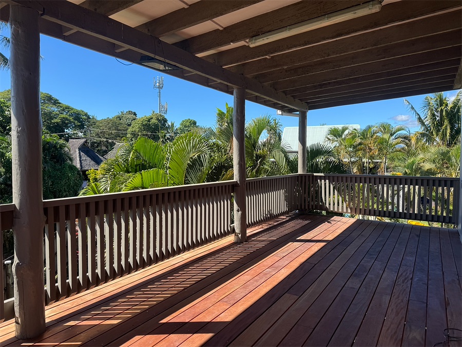 Rebuilt hardwood deck and balustrade in the afternoon sun