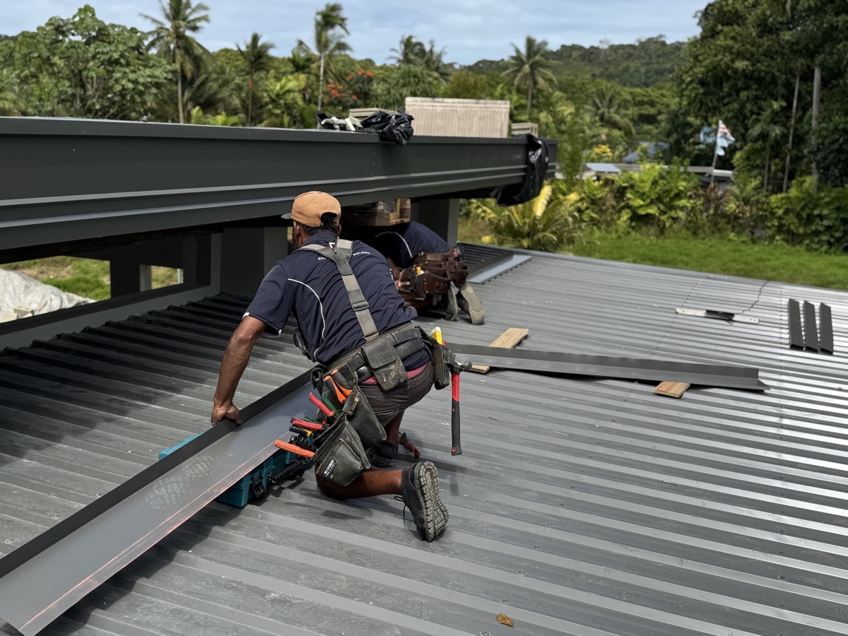 Eden crew fixing new roof sheeting
